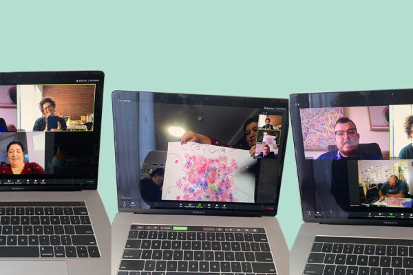 Three laptops with a Zoom call on the screens.