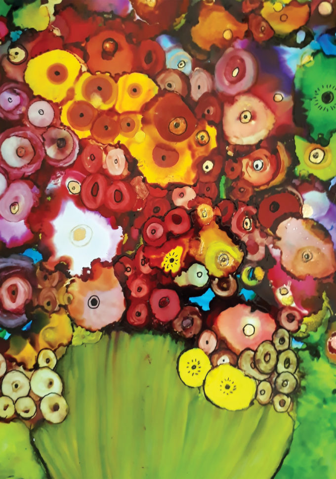 An abstract oil inks painting of flowers, filled with many colours.