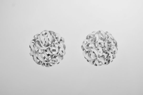 A drawing of many ribbons entwined, forming two spheres frozen in mid-air.