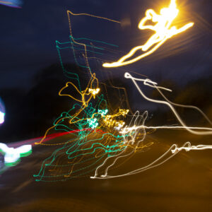 A photograph of a street lamp taken at night time.