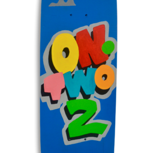 A skateboard with a blue sky background and the text in colourful letters "On Two 2" and the logo "Dismay" resembling the Disney logo.