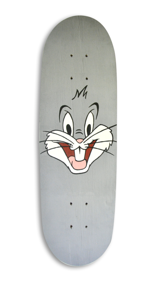 A skateboard with the face of Bugs Bunny painted on a grey background.
