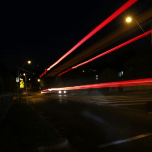 A photograph of a road taken at night time.