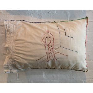 pillow with embroidered man