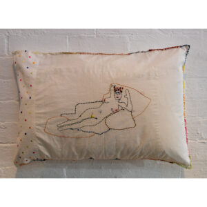 pillow with embroidered woman