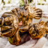 Photo of a bronze fish scupture with blurred background