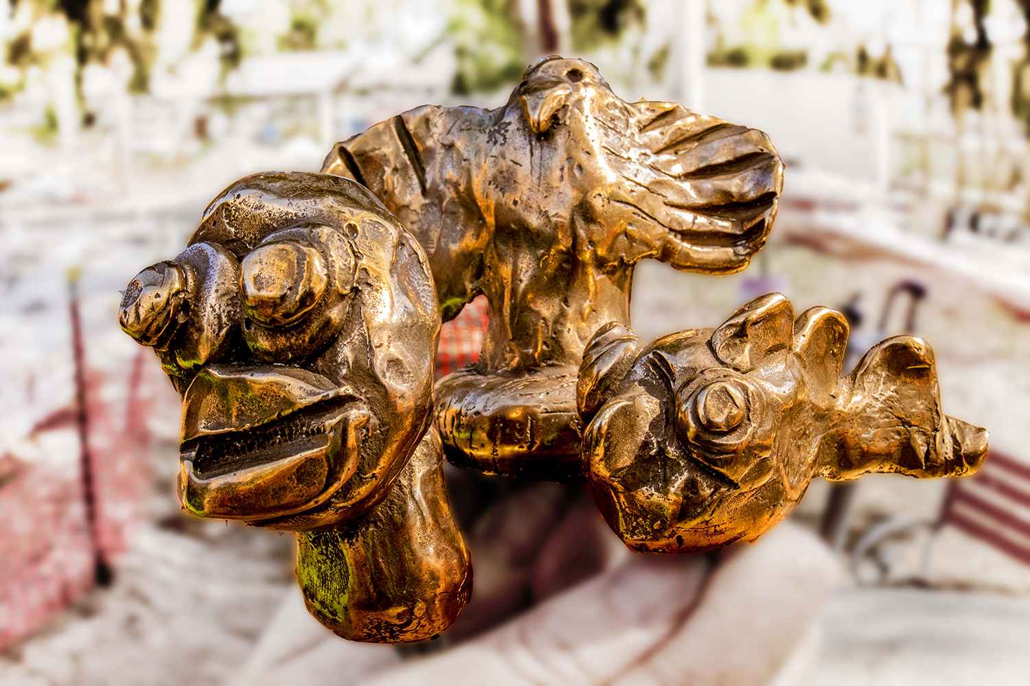 Photo of a bronze fish scupture with blurred background