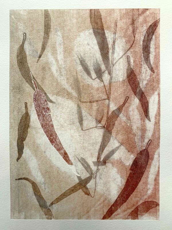 an abstract layered print done in reds, organges and browns. leaves at many different sizes are used to create depth.