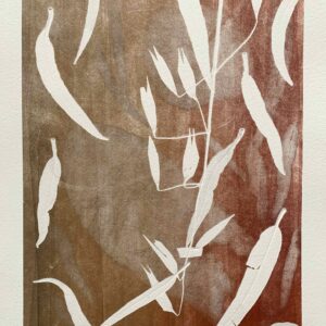 an abstract layered print done in reds, organges and browns. leaves at many different sizes are used to create depth.