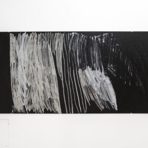 Black rectangular board with swathes of chalk-white vertical brushstrokes in blocks of varying intensity.