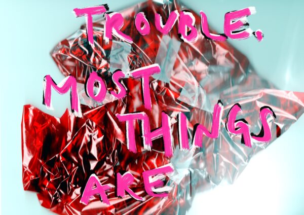 Trouble. Most things are in pink text overlaid on a photo of a crumpled red piece of paper.