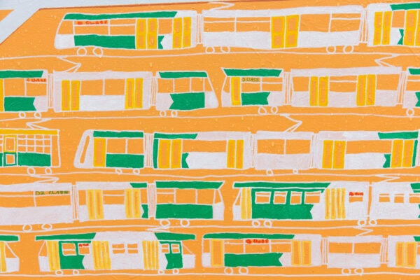 white trams are moving infant of an orange background.