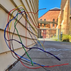8 strands of wire with each painted a different colour of the rainbow.