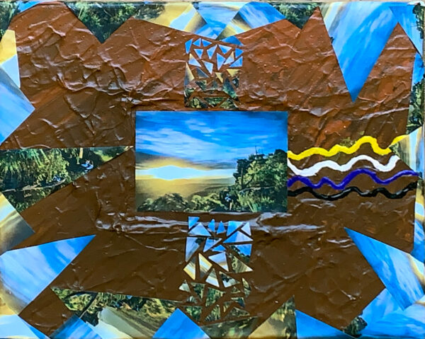 A landscape photo in the centre of a painted canvas.