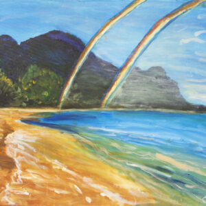 A double rainbow shines on a beach and mountain landscape.