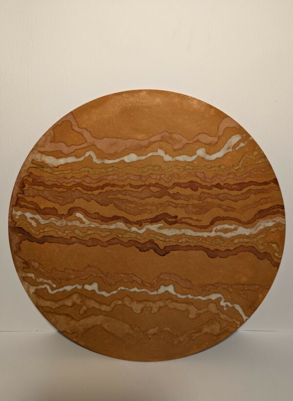 An ochre painting in earthy tones on round wooden board with bumpy lines at irregular spaces going horizontal across the board.