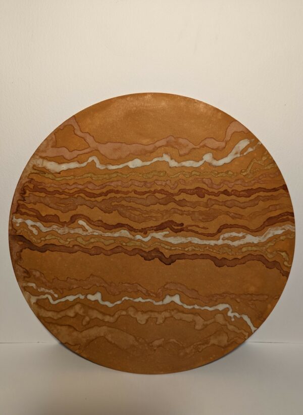 An ochre painting in earthy tones on round wooden board with bumpy lines at irregular spaces going horizontal across the board.