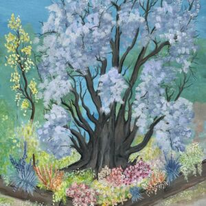 Old blossum tree and colourful garden in Spring