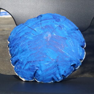 A blue round soft sculpture.