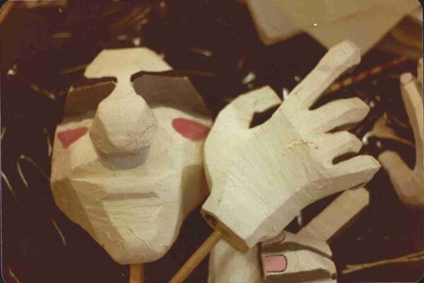 a close up photo of a puppet and its hands