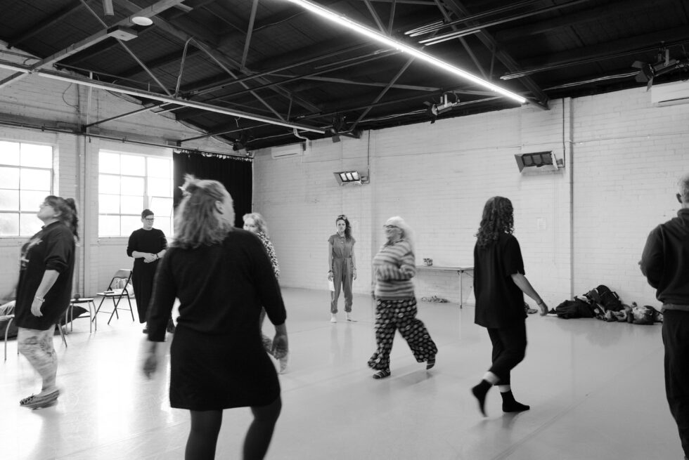 People moving around a warehouse.