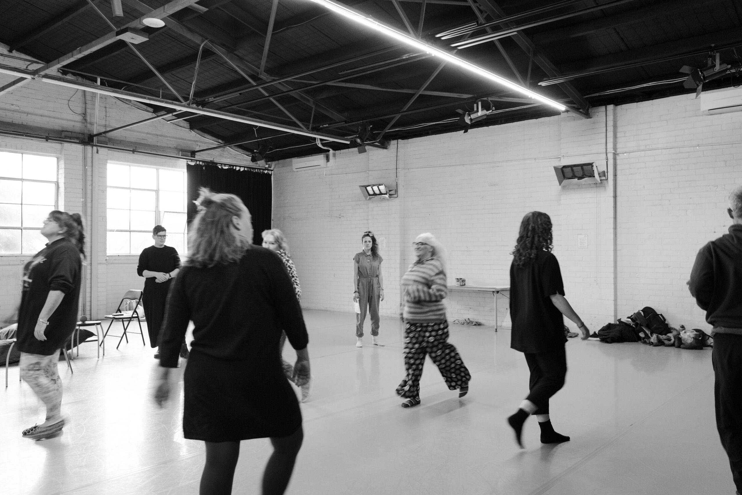 People moving around a warehouse.