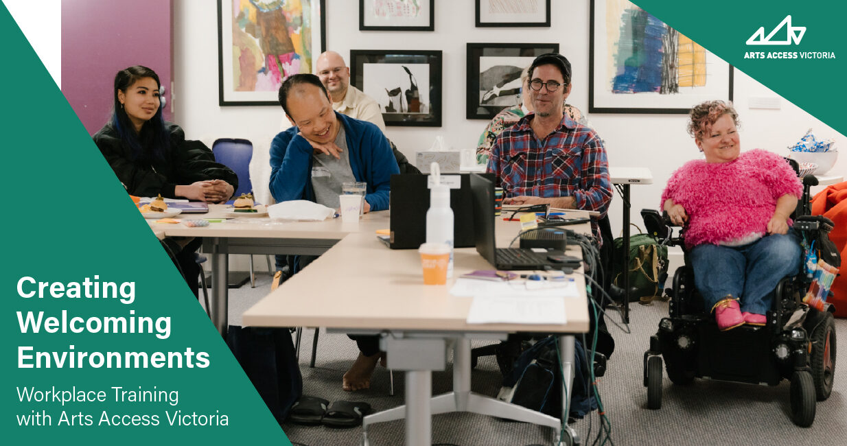 Creating Welcoming Environments. Workplace Training with Arts Access Victoria. 4 people seated at a desk in a room, smiling.