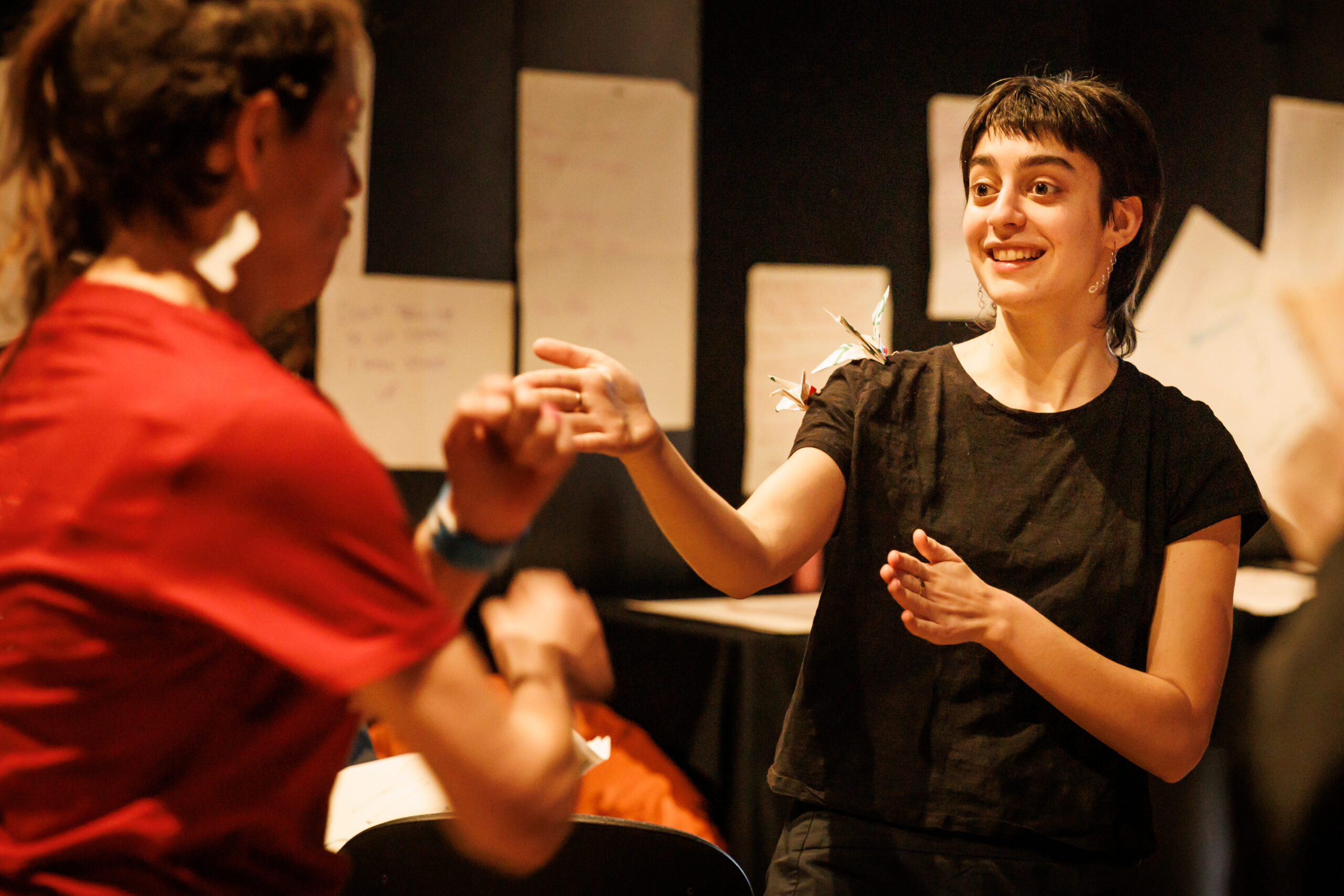 Two people performing a drama warm up exrecise.